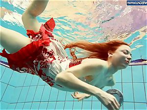 super hot polish redhead swimming in the pool
